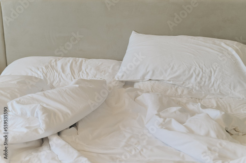 Unmade bedding sheets and pillow. Unmade messy bed after comfortable sleep concept