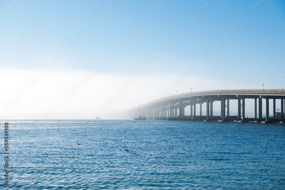 Dense fog rolling over a large causeway in Destin, Florida Dense fog rolling over a large causeway in Destin, Florida