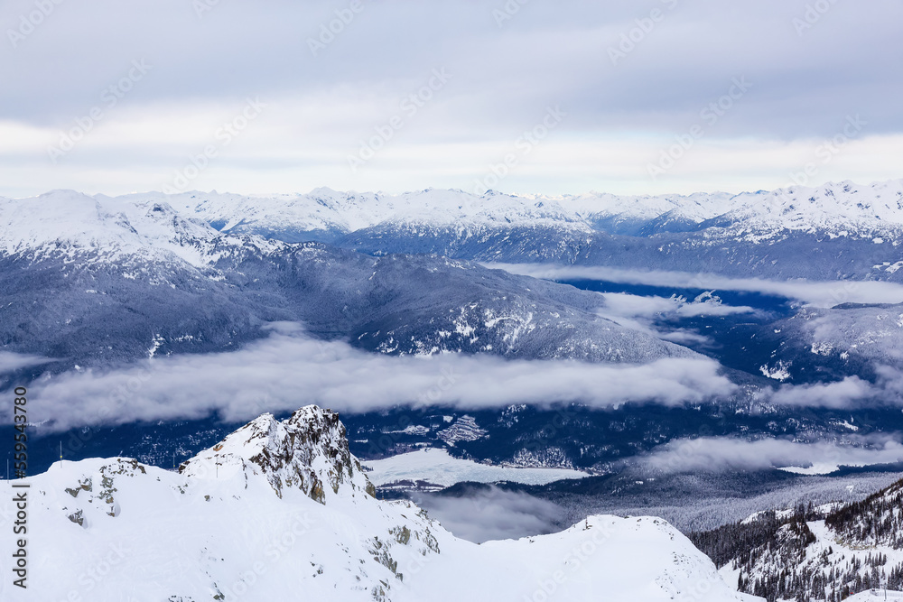 Canadian Mountain Landscape Nature Background covered in snow. Blackcomb Mountain in Whistler, British Columbia, Canada.