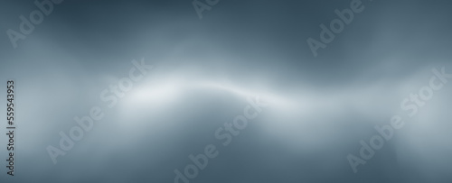 Realistic fog, blurred blue white volumetric light copy space background.