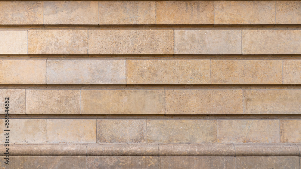 Dolomite stone wall. Rustication. Architectural detail