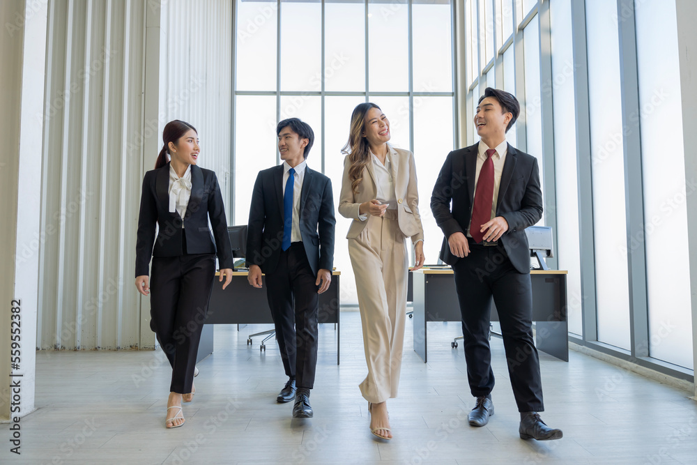 A group of young Asian businessmen Talking and planning work happily and have fun. at the company's office