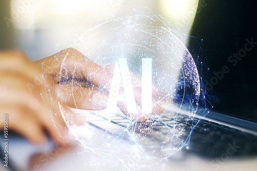 Creative artificial Intelligence symbol concept with hands typing on computer keyboard on background. Double exposure