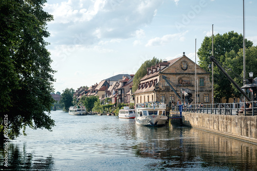 View to city center with river Regnitz, half timbered houses and ship.