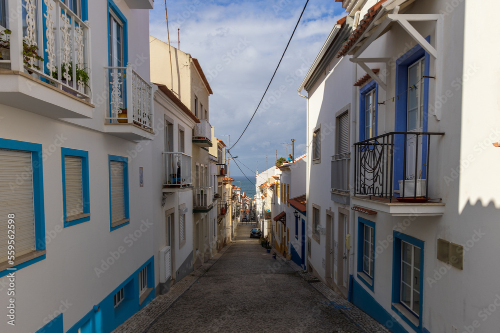 Narrow steep street leading to the beach in Nazaré, Portugal