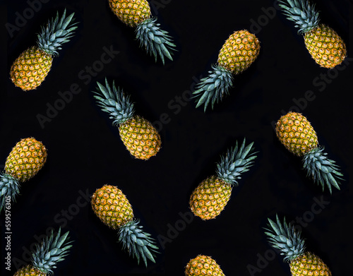 Pineapple on the black background. Pattern. Flat lay.