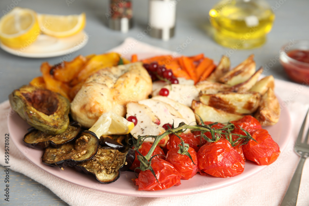 Tasty cooked chicken fillet and vegetables served on table. Healthy meals from air fryer