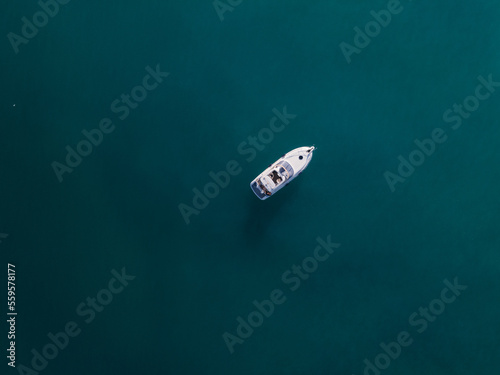 aerial view of a yacht on blue water 