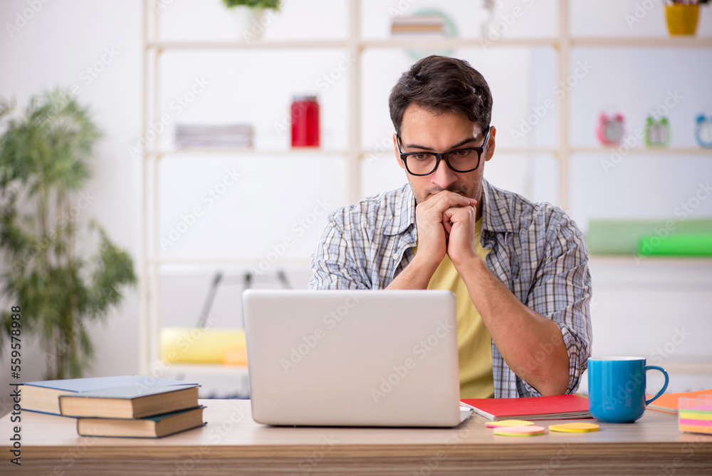 Young male freelancer working from home Young male freelancer working from home