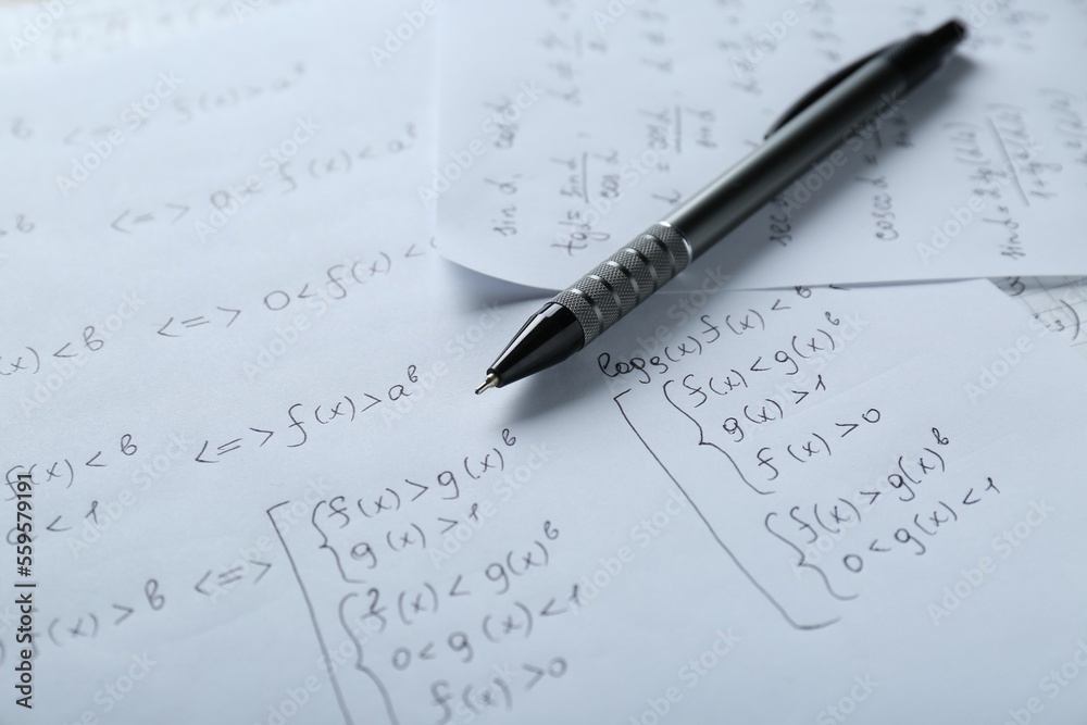 Sheets of paper with different mathematical formulas and pen, closeup Sheets of paper with different mathematical formulas and pen, closeup