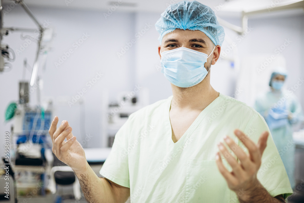 Surgeon washing hands, preparing for the operation Surgeon washing hands, preparing for the operation
