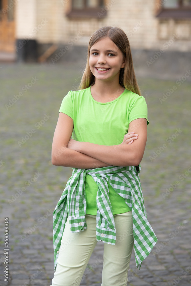 glad casual teen girl in the street. photo of casual teen girl wearing green. casual teen girl glad casual teen girl in the street. photo of casual teen girl wearing green. casual teen girl