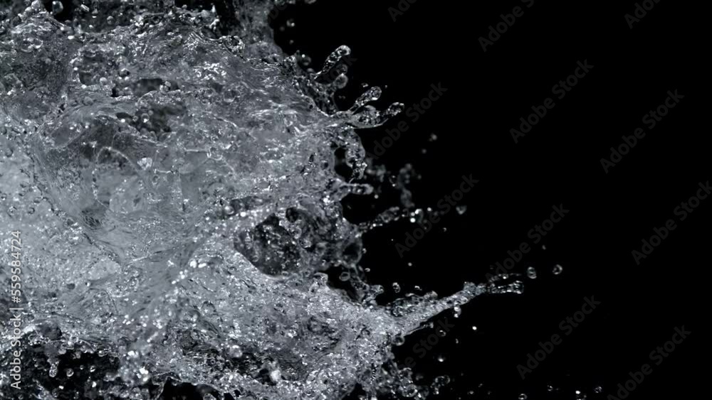 Super Slow Motion Shot of Real Side Water Splash Explosion on Black Background at 1000fps. Super Slow Motion Shot of Real Side Water Splash Explosion on Black Background at 1000fps.