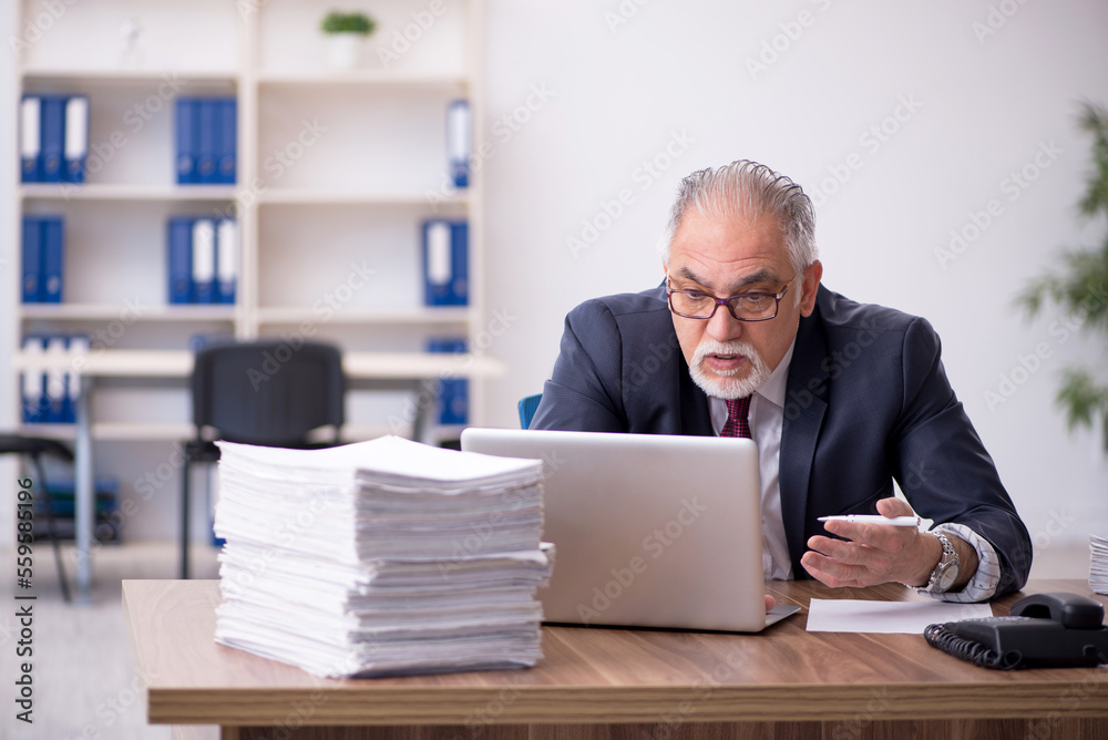 Old male employee and too much work in the office
