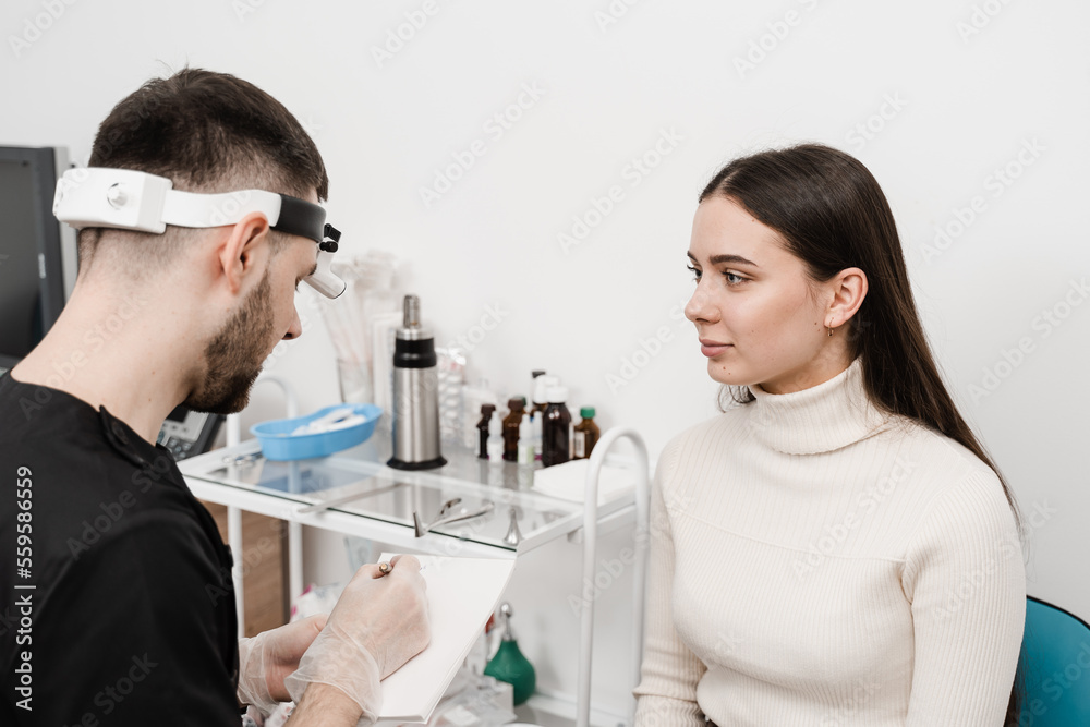 Visiting ENT doctor for examination of the state of health of the ear, throat and nose. Consultation of woman with otolaryngologist in a medical clinic. Visiting ENT doctor for examination of the state of health of the ear, throat and nose. Consultation of woman with otolaryngologist in a medical clinic.