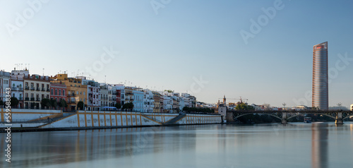 Sunset over the authentic neighborhood of Tirana in Seville with views on Calle Betis, Torre Sevilla and with awesome reflections in the river Guadalquivir, creating magic atmosphere and views © KimWillems