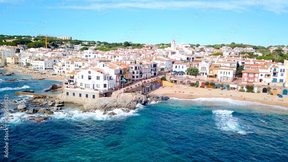 Naklejka premium aerial view from the Mediterranean Sea on the beautiful seaside town of Calella de Palafrugell at the Costa Brava, fishing village, tourism, Palafrugell, Baix Empordà, Girona, Catalonia, Spain