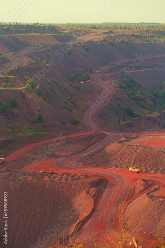 Iron ore quarry landscape with transport