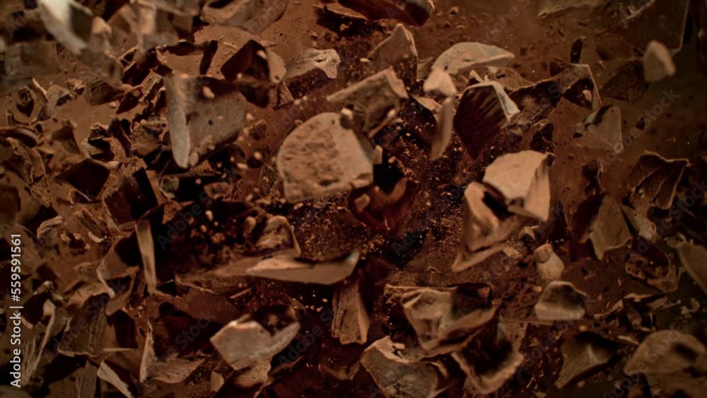 Super Slow Motion Shot of Rotating Raw Chocolate Chunks and Cocoa after Being Exploded at 1000fps. Super Slow Motion Shot of Rotating Raw Chocolate Chunks and Cocoa after Being Exploded at 1000fps.