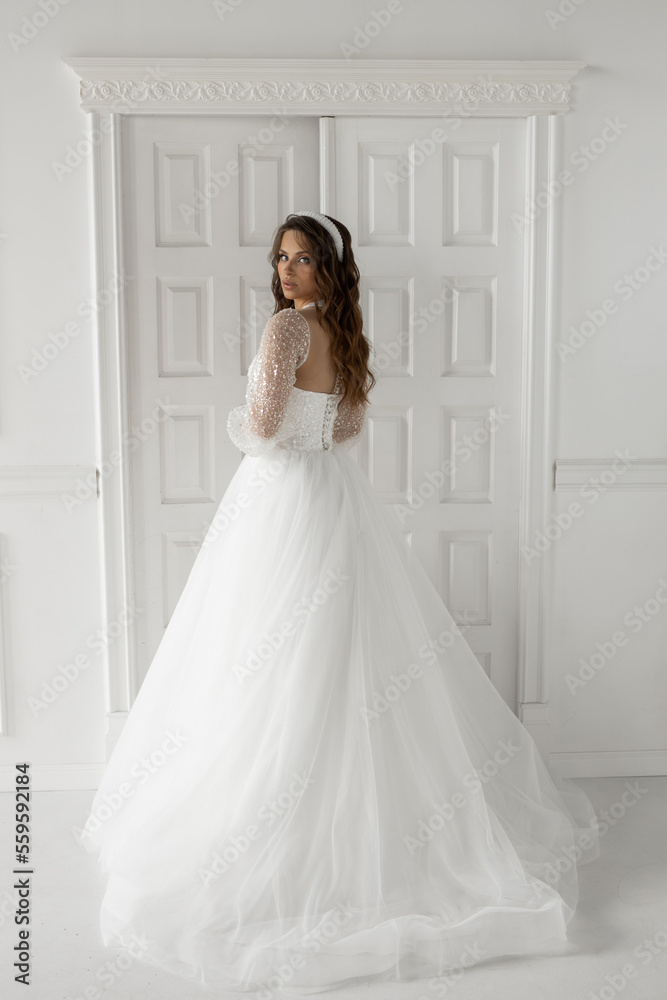 stylish caucasian bride in white wedding dress	