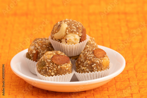 Indian Winter Delicacy White Ball Shaped Tilgul Laddu Or Safed Til Ki Laddo Is Made Of Roasted Sesame Seed, Jaggery, Gur, Gud, Makhana, Kaju, Badam Is Enjoyed In Winter On Makar Sankranti and Lohri