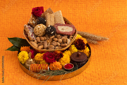 Gulab Gajak Mithai, Pista Gazak, Til Patti Or Papdi, Til Laddu Or Ladoo, Revdi And Rewri Made Of Tilgul, Mungfali, Sesame Seed, Jaggery Gud, Badam And Pista For Makar Sankranti Or Lohri Celebration photo