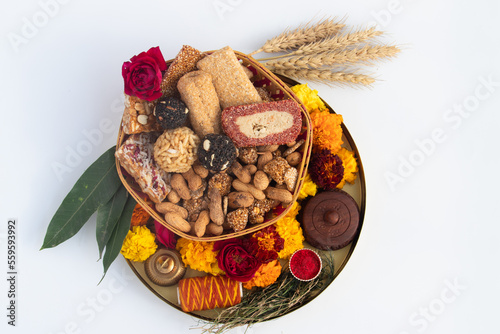 Gulab Gajak Mithai, Pista Gazak, Til Patti Or Papdi, Til Laddu Or Ladoo, Revdi And Rewri Made Of Tilgul, Mungfali, Sesame Seed, Jaggery Gud, Badam And Pista For Makar Sankranti Or Lohri Celebration photo