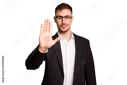 Young caucasian business man cutout isolated standing with outstretched hand showing stop sign, preventing you.