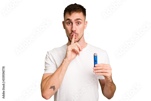 Young caucasian man holding a vaporizer cut out isolated keeping a secret or asking for silence.