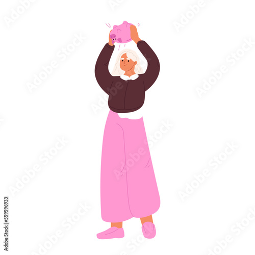 Woman shaking pink piggy bank with coins. Unhappy female in financial crisis and difficulties