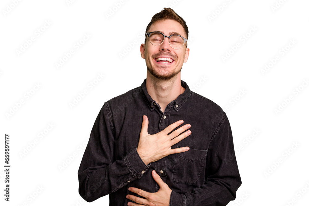 Young caucasian man cut out isolated laughs happily and has fun keeping hands on stomach. Young caucasian man cut out isolated laughs happily and has fun keeping hands on stomach.