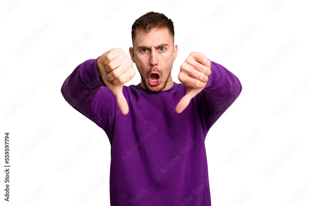 Fototapeta premium Young caucasian man cut out isolated showing thumb down and expressing dislike.