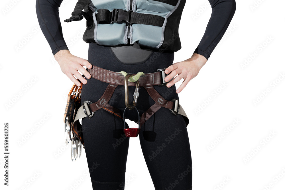 Man wearing climbing gear a black full wetsuit and buoyancy aid with a