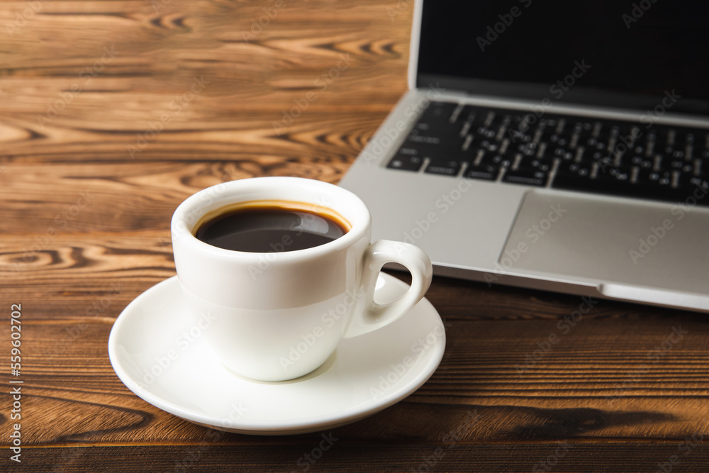 Laptop with coffee cup home office.office concept. Business concept. Work at home. Workspace with laptop. Mocap. Place for text. Copy space. Laptop with coffee cup home office.office concept. Business concept. Work at home. Workspace with laptop. Mocap. Place for text. Copy space.