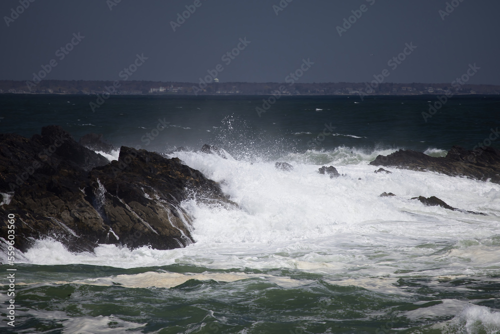 Ocean waves crashing against a rocky shore
