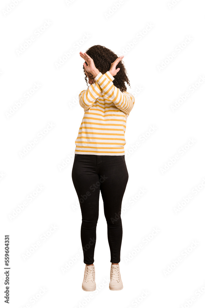 Young african american woman with curly hair cut out isolated keeping two arms crossed, denial concept. Young african american woman with curly hair cut out isolated keeping two arms crossed, denial concept.