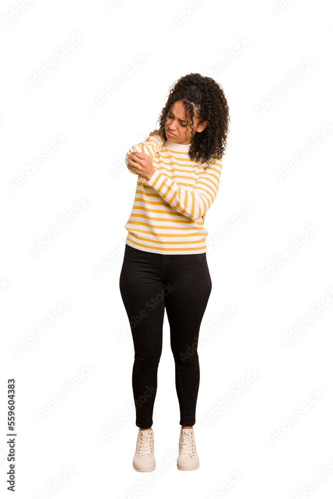 Young african american woman with curly hair cut out isolated massaging elbow, suffering after a bad movement. Young african american woman with curly hair cut out isolated massaging elbow, suffering after a bad movement.