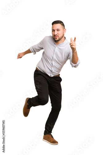 Adult latin man dancing cut out isolated