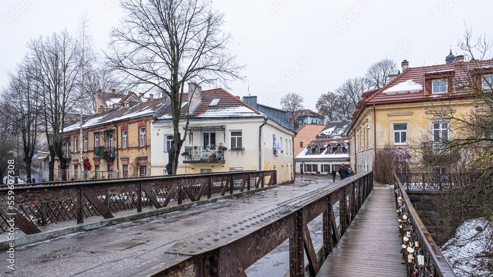 View of Uzupis Neighborhood buildings and streets in winter surrounded by Vilnia River, Vilnius, Lithuania