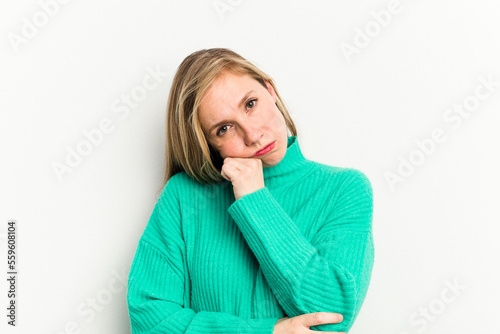 Young caucasian woman isolated on white background tired of a repetitive task. © Asier
