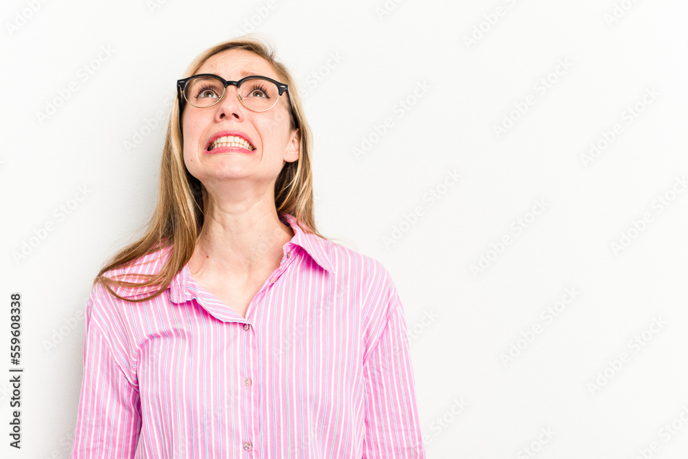Young caucasian woman isolated on white background shouting very angry, rage concept, frustrated. Young caucasian woman isolated on white background shouting very angry, rage concept, frustrated.