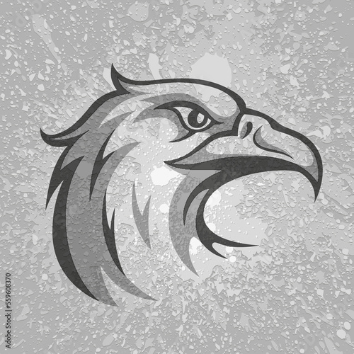 Black and grey eagle head logo on grey dirty plaster layers grunge splashes background