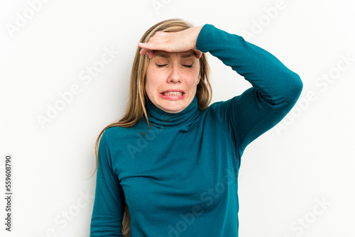 Young caucasian woman isolated on white background touching temples and having headache.