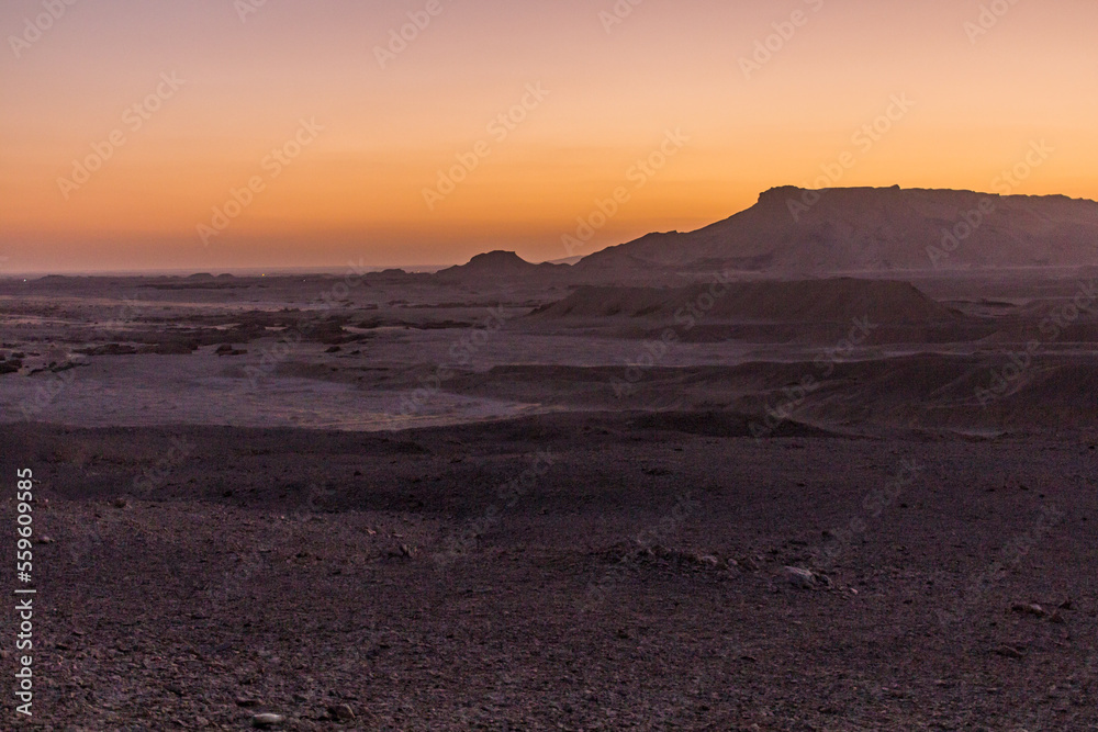 Sunset in a desert near Dakhla oasis, Egypt
