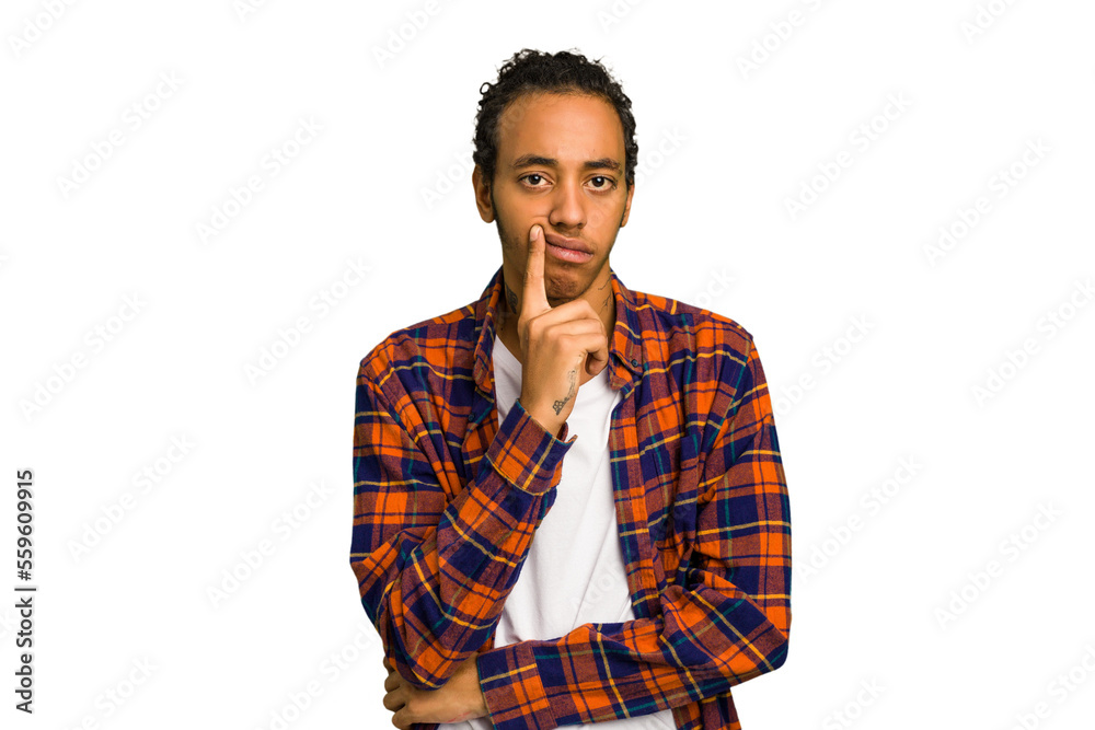 Young African American man isolated looking sideways with doubtful and skeptical expression. Young African American man isolated looking sideways with doubtful and skeptical expression.