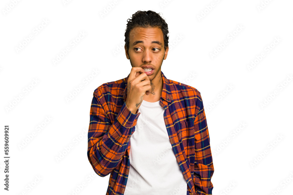 Young African American man isolated relaxed thinking about something looking at a copy space. Young African American man isolated relaxed thinking about something looking at a copy space.