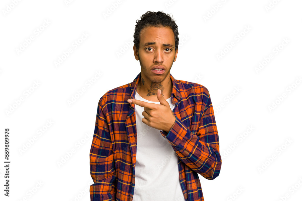 Young African American man isolated pointing to the side Young African American man isolated pointing to the side