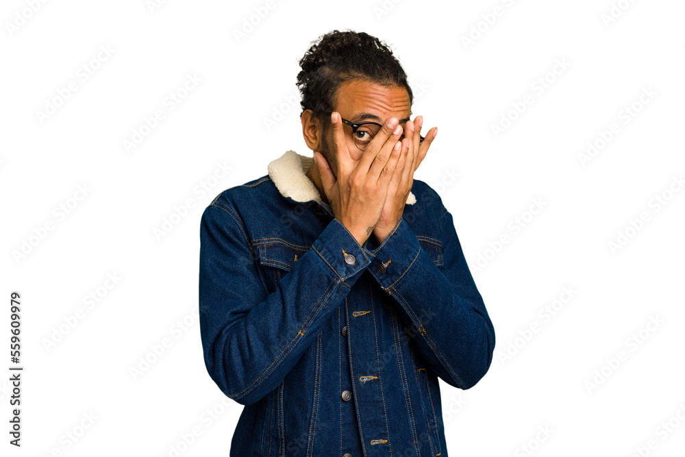 Young African American man isolated blink through fingers frightened and nervous. Young African American man isolated blink through fingers frightened and nervous.