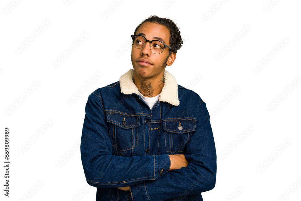 Young African American man isolated dreaming of achieving goals and purposes Young African American man isolated dreaming of achieving goals and purposes