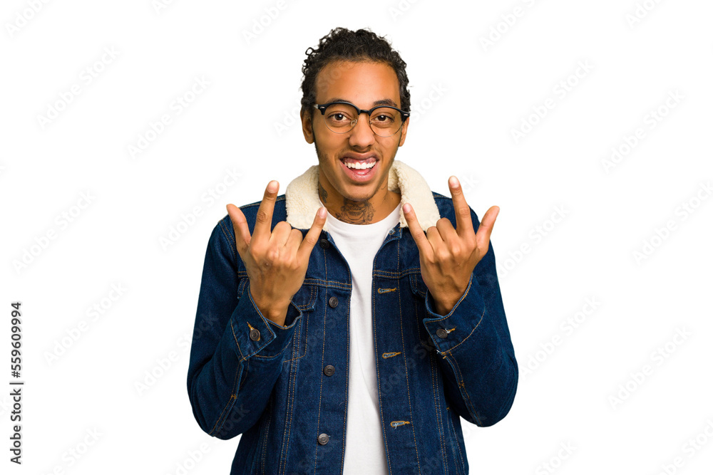 Young African American man isolated showing a horns gesture as a revolution concept. Young African American man isolated showing a horns gesture as a revolution concept.
